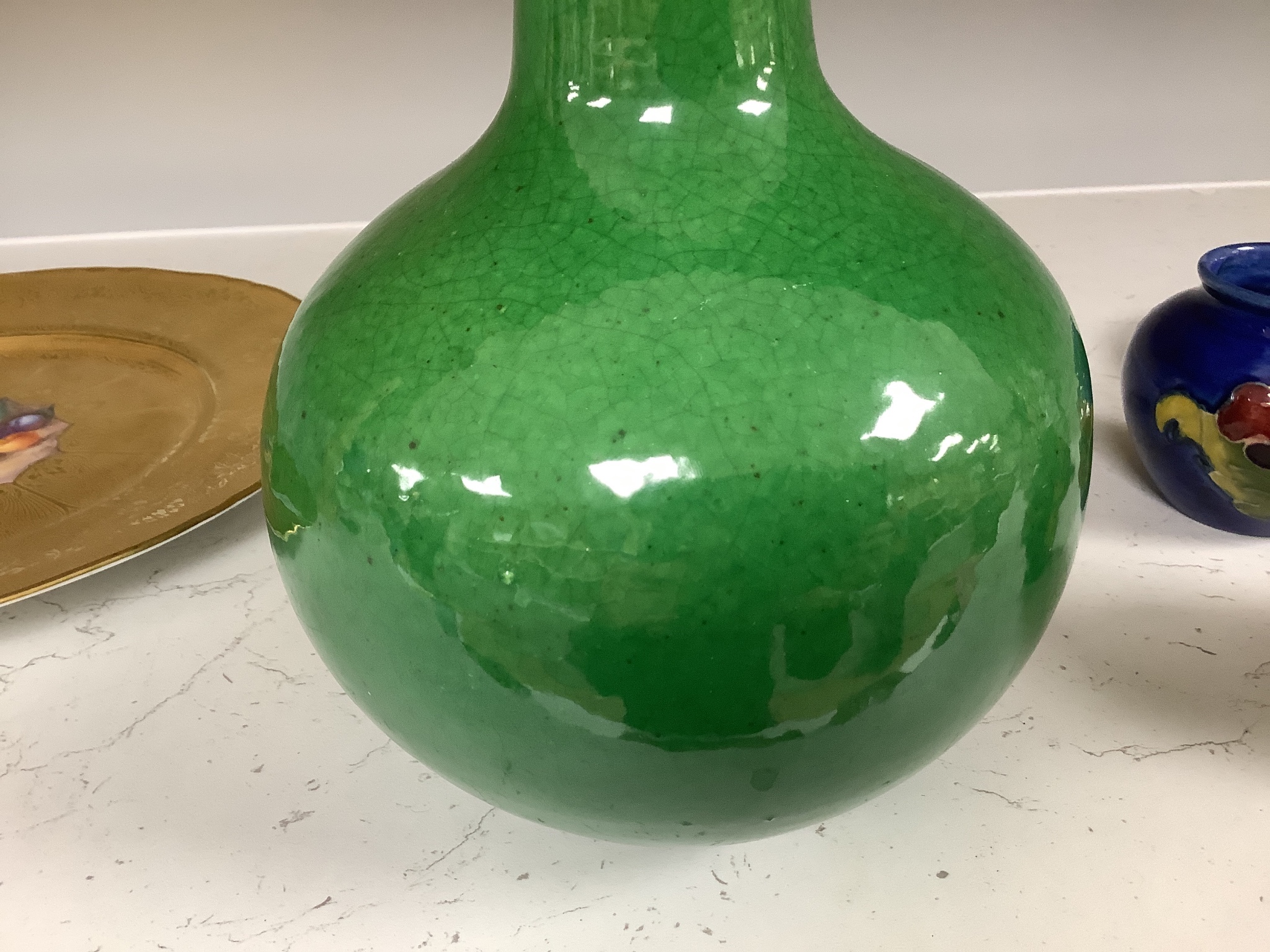 A Chinese green crackle glaze monochrome bottle vase, 24 cm high